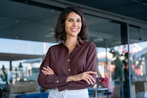 Confident, smiling woman in business setting