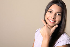 smiling young woman showing her bright, beautiful teeth