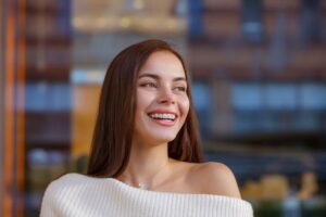 Happy, smiling woman with braces