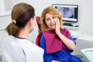 Middle-aged woman talking to her dentist